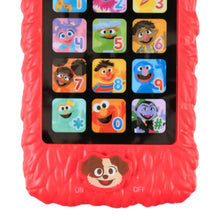 Red Elmo learning phone with character number buttons on a black screen panel