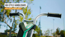 Teal-accent mini tricycle handlebars with black rubber grips and control deck