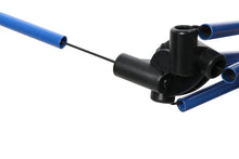 Camping chair frame connector with black joint and blue tubular legs.