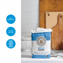 Unbleached bread flour bag with Non-GMO and kosher icons, blue and white.