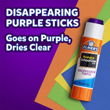 Disappearing purple school glue stick, goes on purple and dries clear, orange cap