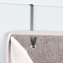 Gray fabric loop with metal hook for over-the-door mounting