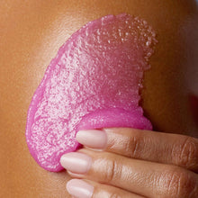 Tree Hut Raspberry Fizz sugar scrub smear on skin, bright pink granular texture