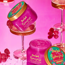 Tree Hut Raspberry Fizz sugar scrub jars with orange lids and pink foam swirl