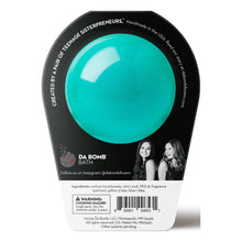 Black bath fizzle container with teal dome graphic and product label on back