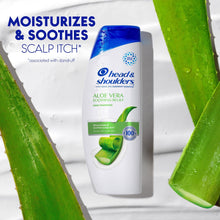 Aloe Vera soothing relief shampoo bottle with green aloe leaves, white bottle and blue cap
