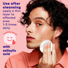 Oil-free acne toner application with salicylic acid using a cotton pad