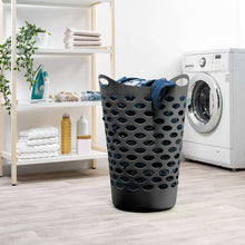 Dark blue laundry hamper with cutout oval sides and top carry handles
