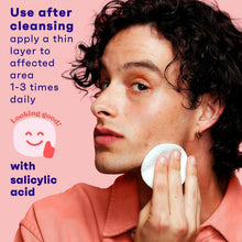 Acne toner use with cotton pad on face by person with short hair