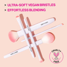 Assorted vegan makeup brushes with ultra-soft synthetic bristles; white and pink handles