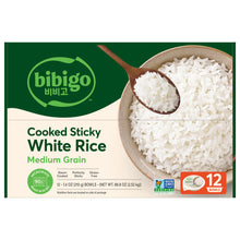 bibigo cooked sticky white rice box with bowl and spoon of white rice