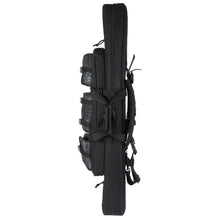 Black rifle bag side view with multiple front pockets, straps, and buckles