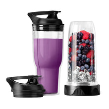 NutriBullet purple travel cup and clear blending jar with mixed berries