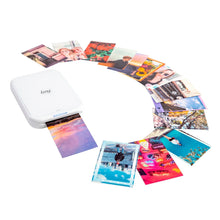 White Canon IVY 2 mini photo printer with multiple small photo prints