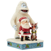 Angled view of Jim Shore holiday statue with Santa, Rudolph, and Bumble
