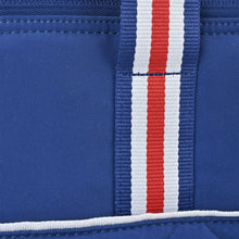 Close-up of blue cooler bag webbing strap with red, white, and blue stripe trim