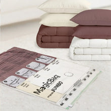 Vacuum storage bags set with maroon, white, and dark green folded comforters