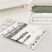 Vacuum storage bag set with a white labeled bag and folded bedding stacks