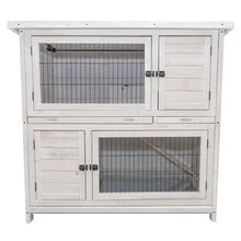 Two-story rabbit hutch with white wood panels and two wire-front doors