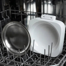 White pet feeder with open top over a stainless-steel bowl in a rack
