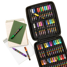 POSCA marker set in open case with notebooks and several loose markers