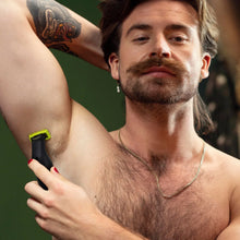 Hybrid electric trimmer shaver trimming chest hair with yellow blade