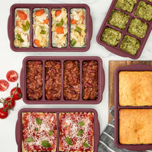 MIU silicone freezer trays with lids, dark red, shown filled with frozen portions