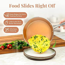 Copper hammered nonstick pan with lid, holding a sliced egg omelet