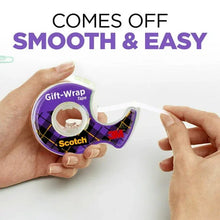 Hands applying white tape from a purple plaid Scotch gift-wrap dispenser