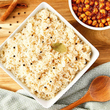 Basmati rice serving in a white bowl with visible grains and peppercorns