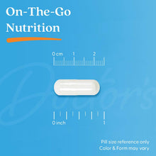 White supplement capsule on a pill size reference card with measurement lines