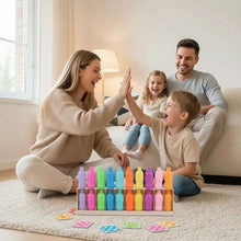Family playing color bottle memory game with colorful bottles and cards on floor