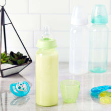 Newborn baby bottles set with green bottle, blue pacifier, and matching cup