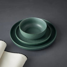 Caspian green ceramic dinnerware set with stacked bowl and plate