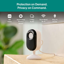 Indoor security camera on tabletop base with privacy shield closed