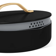 Black sauté pan with vented strainer lid insert and gold-tone handle