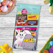 Easter candy bag 55 pieces with M&M's, Skittles, Starburst, Snickers on table