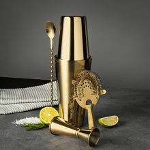 Gold stainless-steel bar tools set with jigger, shaker, bar spoon, citrus strainer