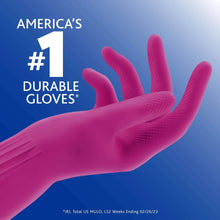 Magenta rubber cleaning glove with textured palm and fingers, close-up