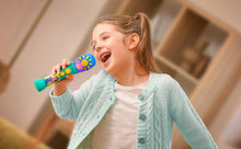 Child drinking-style playing pose with a teal sing-along microphone