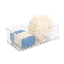 Clear plastic organizer bin filled with soap bars and loofah, rectangular open-top