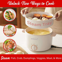 White electric hot pot cooker with steamer tray insert and food inside