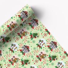 Pale green Christmas wrapping paper with ornaments, trees and snowflakes