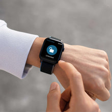 Smartwatch displaying unlocked status next to a door lock with keypad