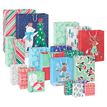 Assortment of Christmas gift bags in colorful prints, sizes and character designs