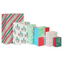 Assorted Christmas gift bags in striped, tree, snowflake and solid color designs