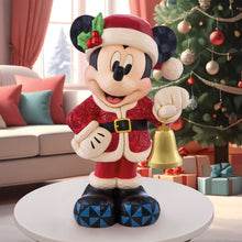 Disney holiday Mickey Mouse statue in a red Santa outfit, holding a gold bell