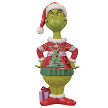 Jim Shore Grinch statue in a red patterned Christmas sweater, Santa hat and red shoes