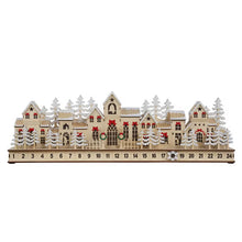 Unlit wooden village Advent calendar with numbered drawers, snowy trees, and festive house details