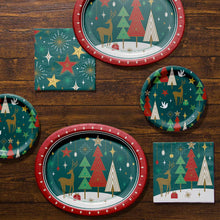 Paper plate and napkin bundle featuring deer, trees, stars and festive motifs